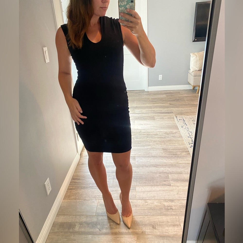 Glare black dress with zip back and plunge v neck.  Size small.